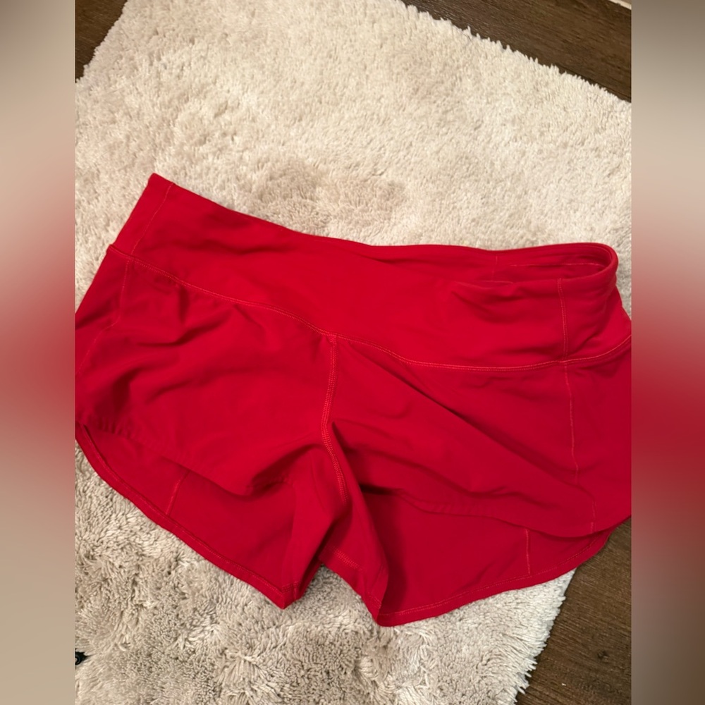 Red Lululemon high rise speed up shorts size 8 2.5”